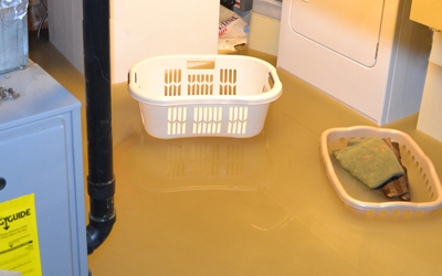 Sewage backup in Delafield, WI unfinished laundry room